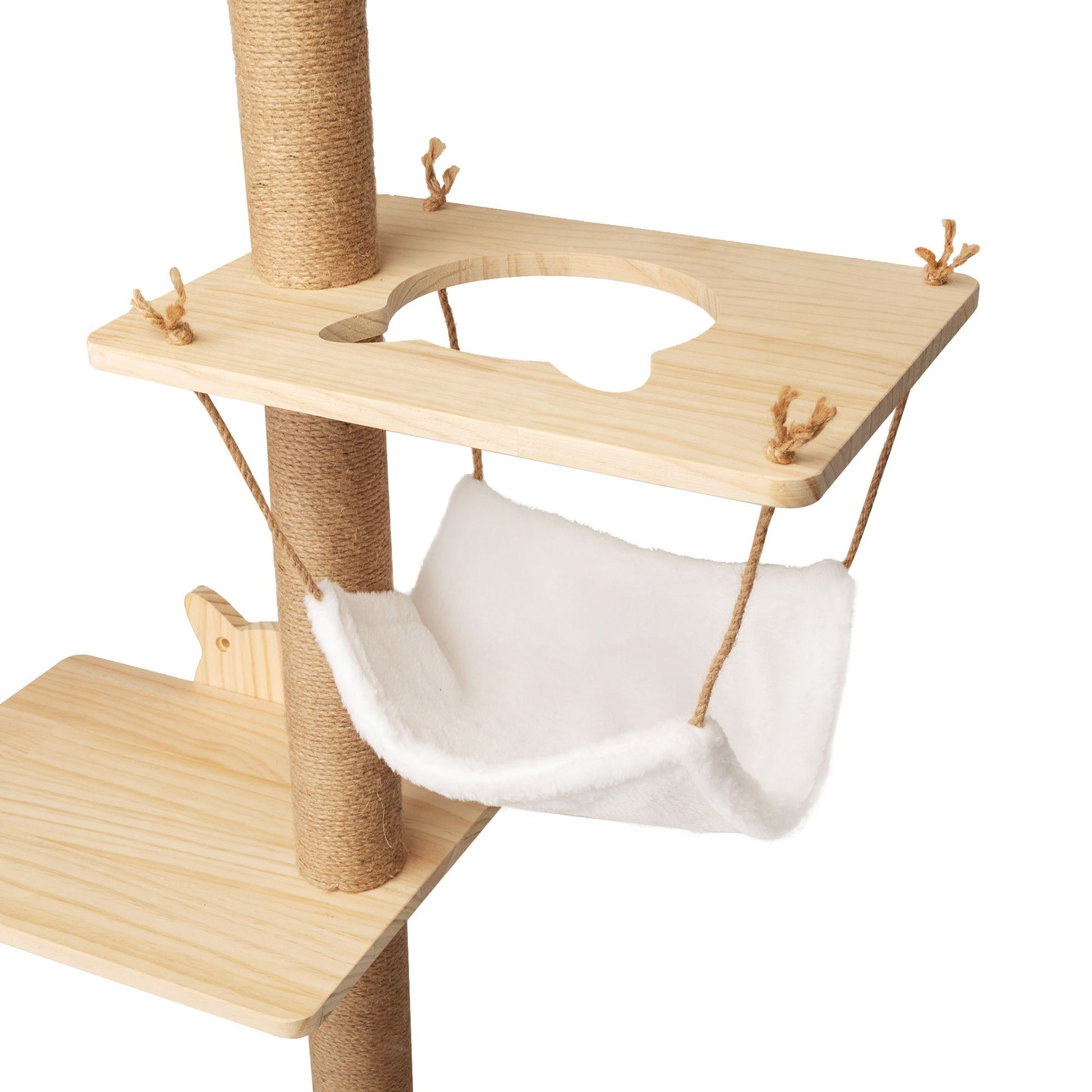 A plush white hammock cradled beneath a pale pine platform with a cat-shaped cutout, suspended by jute cords beside a tall sisal-wrapped post. Designed for mid-climb lounging and cloudlike naps.