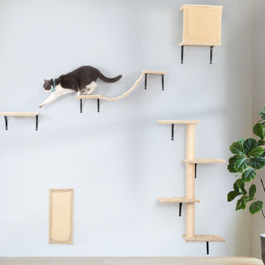 Wall-mounted cat climbing shelves and sisal post create a vertical path across a soft gray wall. A black and white cat strides mid-leap along the platforms, showing the set’s scale, grace, and enrichment in a bright, modern room.