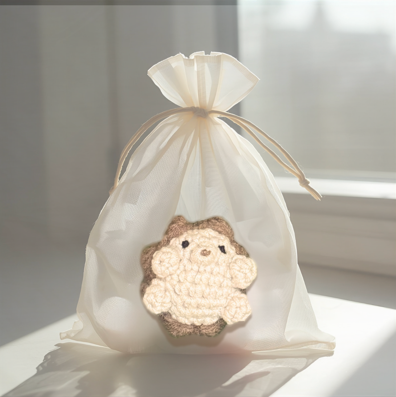 Harold the Hedgehog, a handmade Chunkle Puff catnip toy by Feline Grove, shown with his boutique gift bag. The woven hedgehog toy is presented as a luxury piece designed for gifting and refined play.