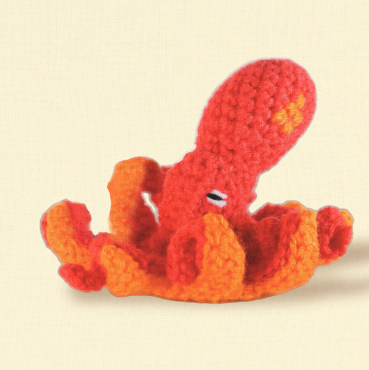 Julie the Kraken, a 6-inch handmade catnip toy from Feline Grove’s Chunkle Puff collection, shown alone on a neutral background. Octopus-inspired woven form highlights luxury craftsmanship and flowing tentacle design.