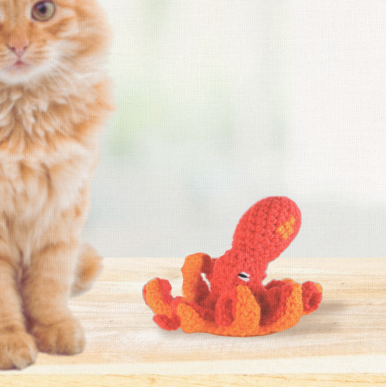 Lifestyle photo of Julie the Kraken, a handmade Chunkle Puff catnip toy by Feline Grove. Shown in a refined interior with soft linen backdrop, presenting her octopus-inspired form as a luxury piece for elegant homes.