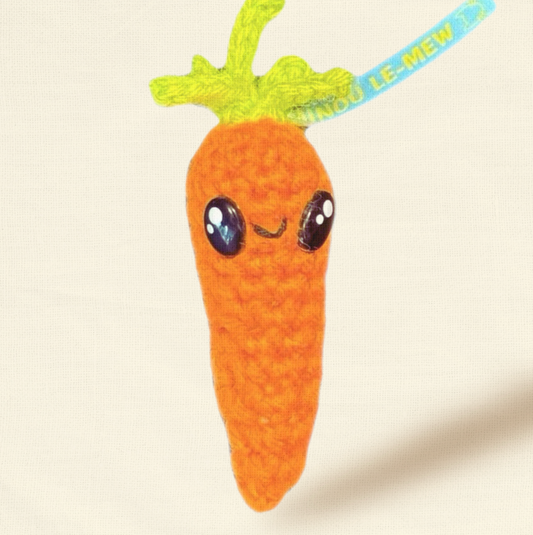 Lulu the Carrot, a 3.5-inch handmade catnip toy from Feline Grove’s Chunkle Puff collection, shown alone on a neutral background. Bright orange woven fibers highlight its carrot shape and luxury craftsmanship.