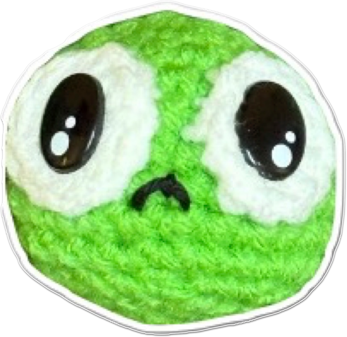 Green and white pea shaped plush Chunkle cat toy with black eyes and frown on a white background