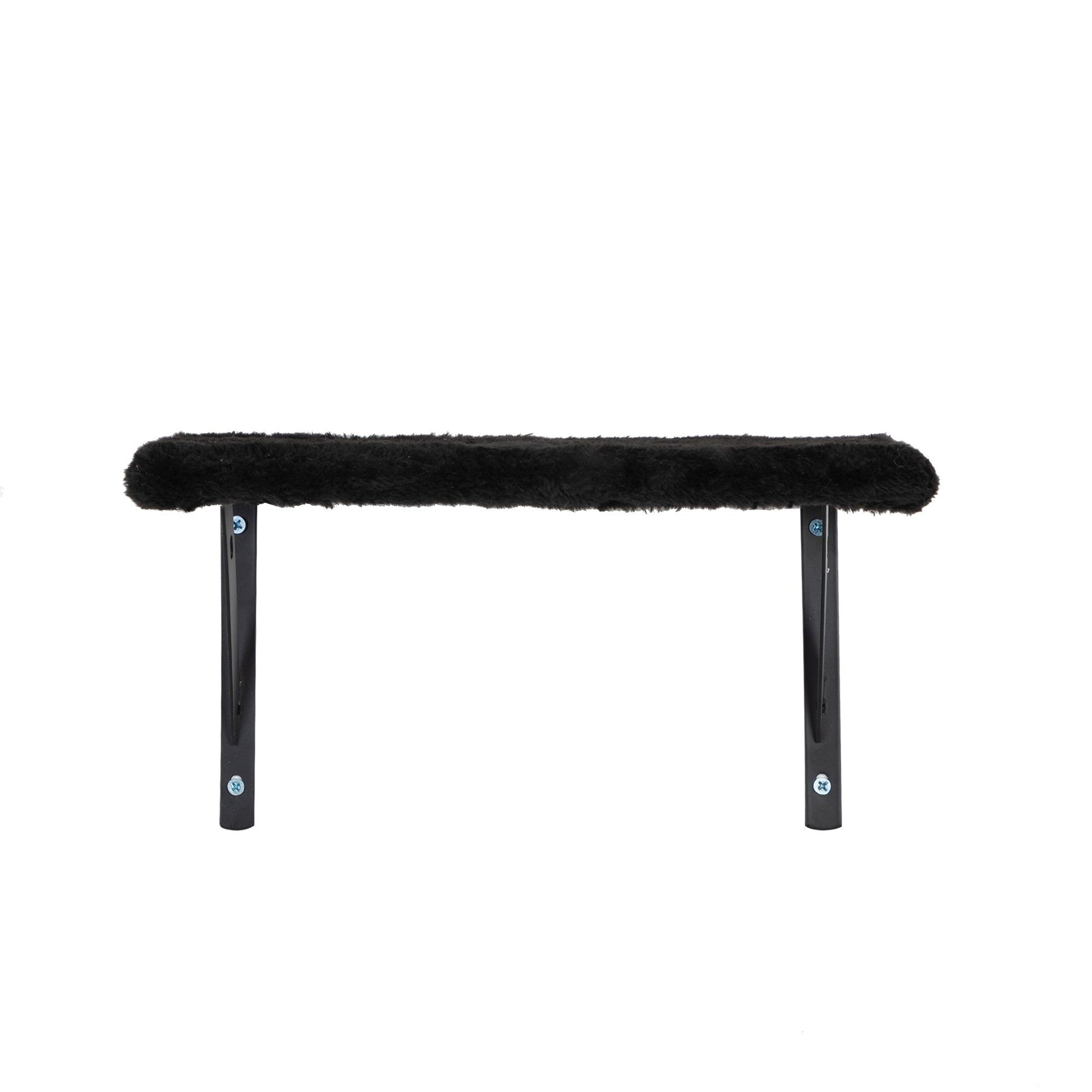 Front view of The Grove Set’s black wall-mounted lounge shelf, featuring a slim plush surface supported by two black metal brackets. A quiet resting spot for elevated pauses between climbs.