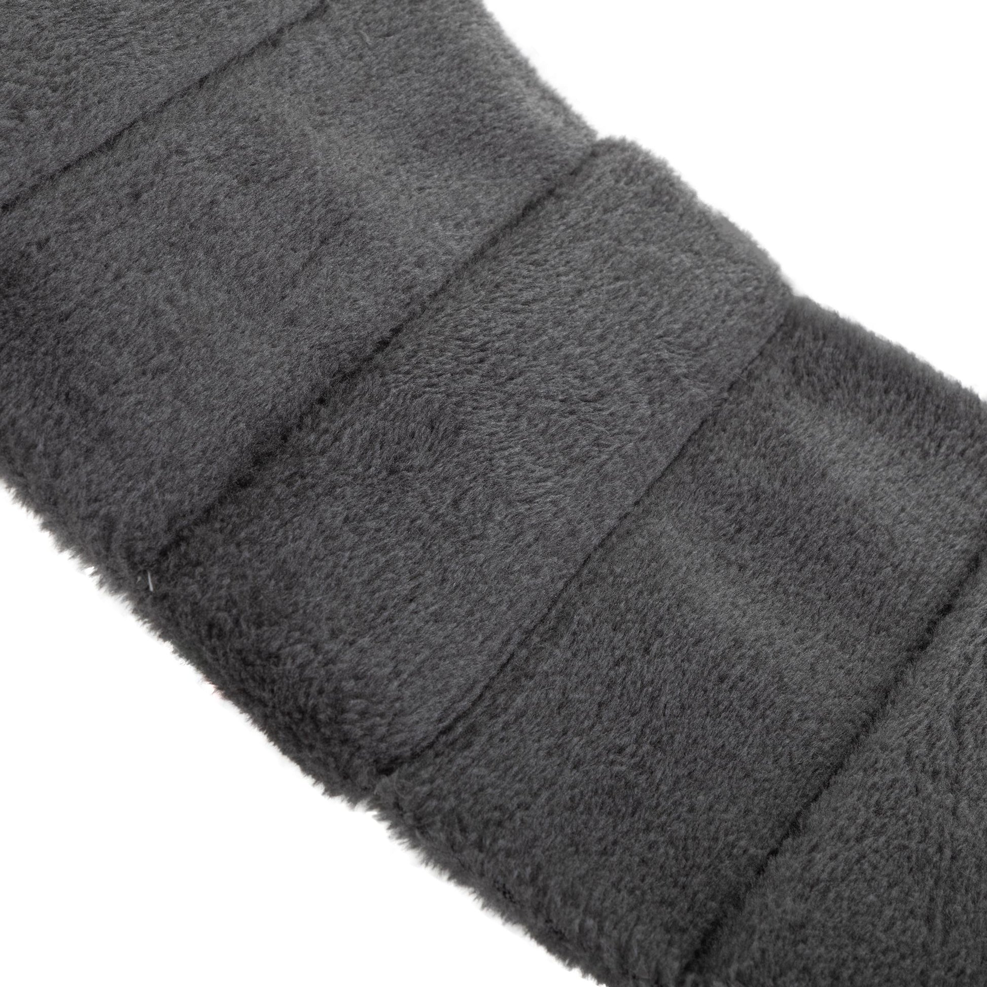Detail of the plush charcoal-grey cat bridge, highlighting the softly padded, segmented design that offers both flexibility and gentle support for graceful feline movement.