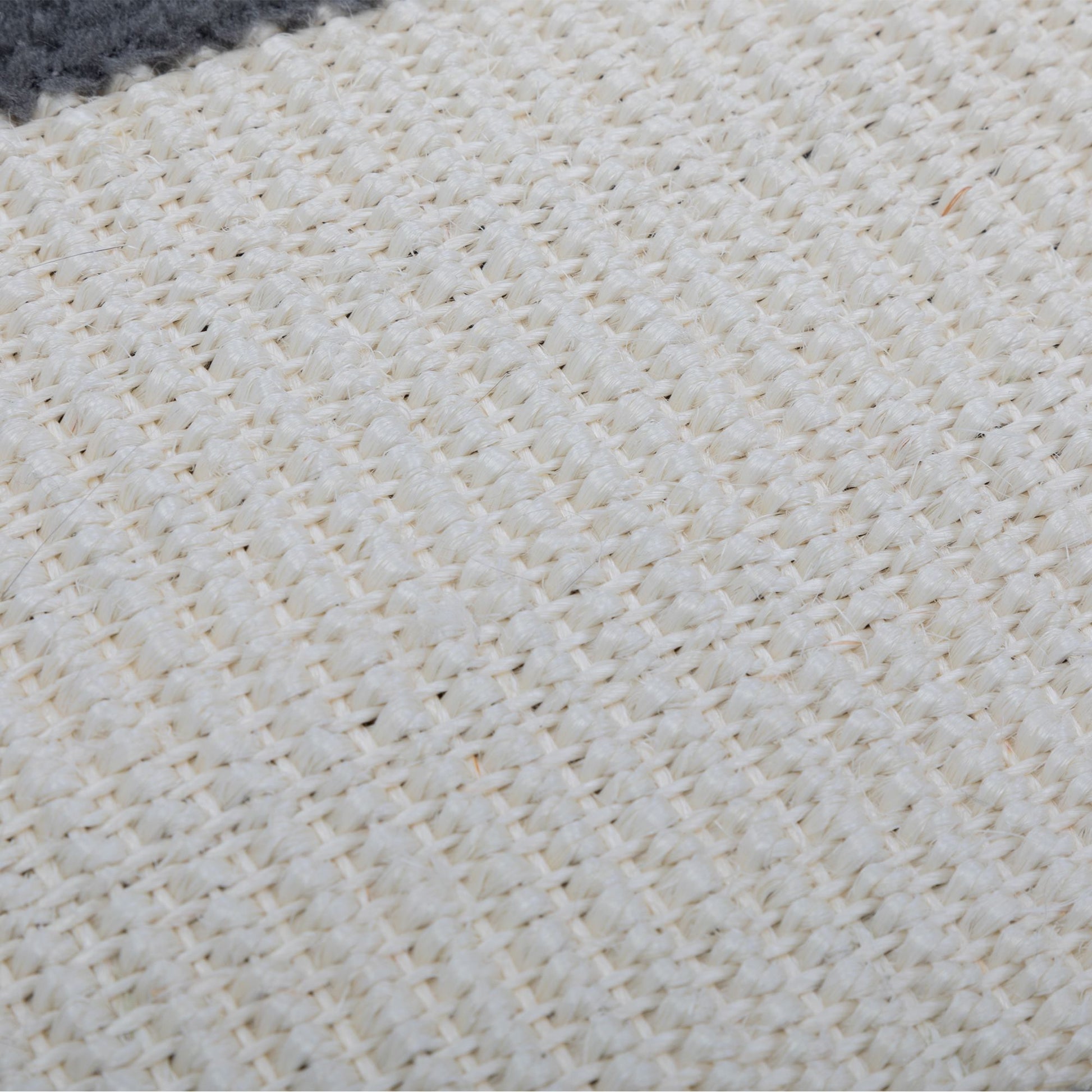 Close-up of the tightly woven natural sisal fabric on The Grove Set’s wall-mounted scratcher, bordered with soft grey plush for a refined, functional detail that invites daily use.