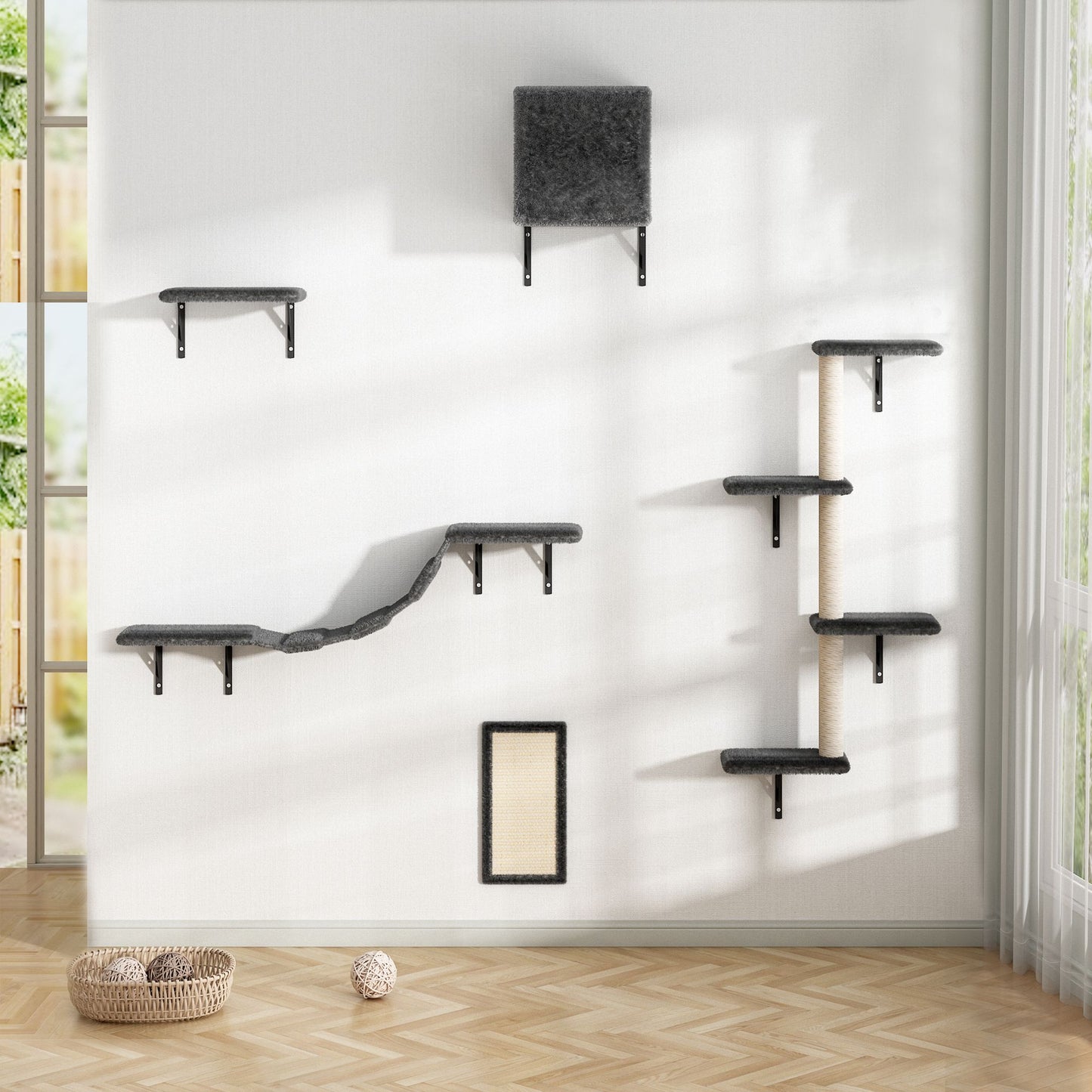 The Grove Set in grey shown fully installed in a sunlit room. The wall-mounted layout includes a bridge, cubby, lounge shelves, vertical tree, and sisal scratch mat—creating a vertical playground for cats in a serene, modern interior.