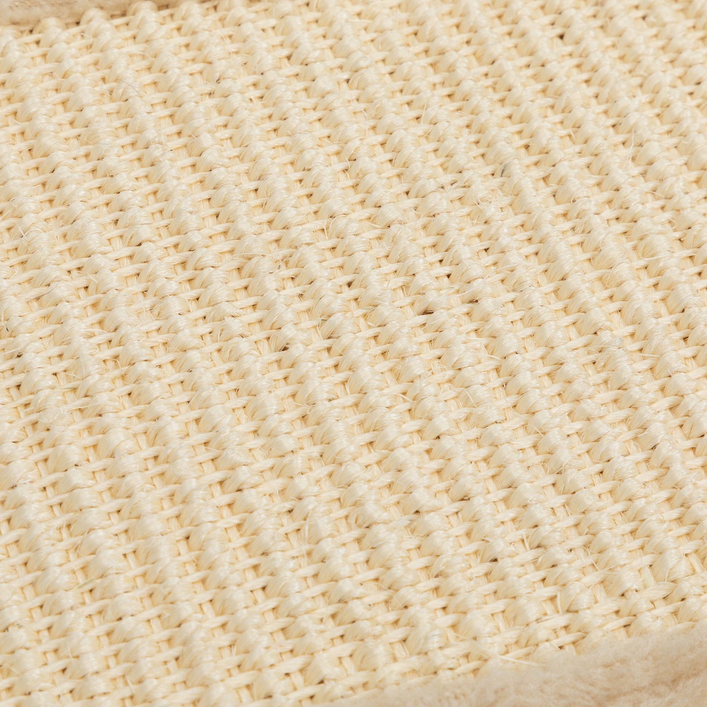 Close-up of The Grove Set’s woven sisal scratch mat. The tightly braided natural fibers offer a durable, satisfying surface for clawing—designed to protect furniture while honoring feline instinct.