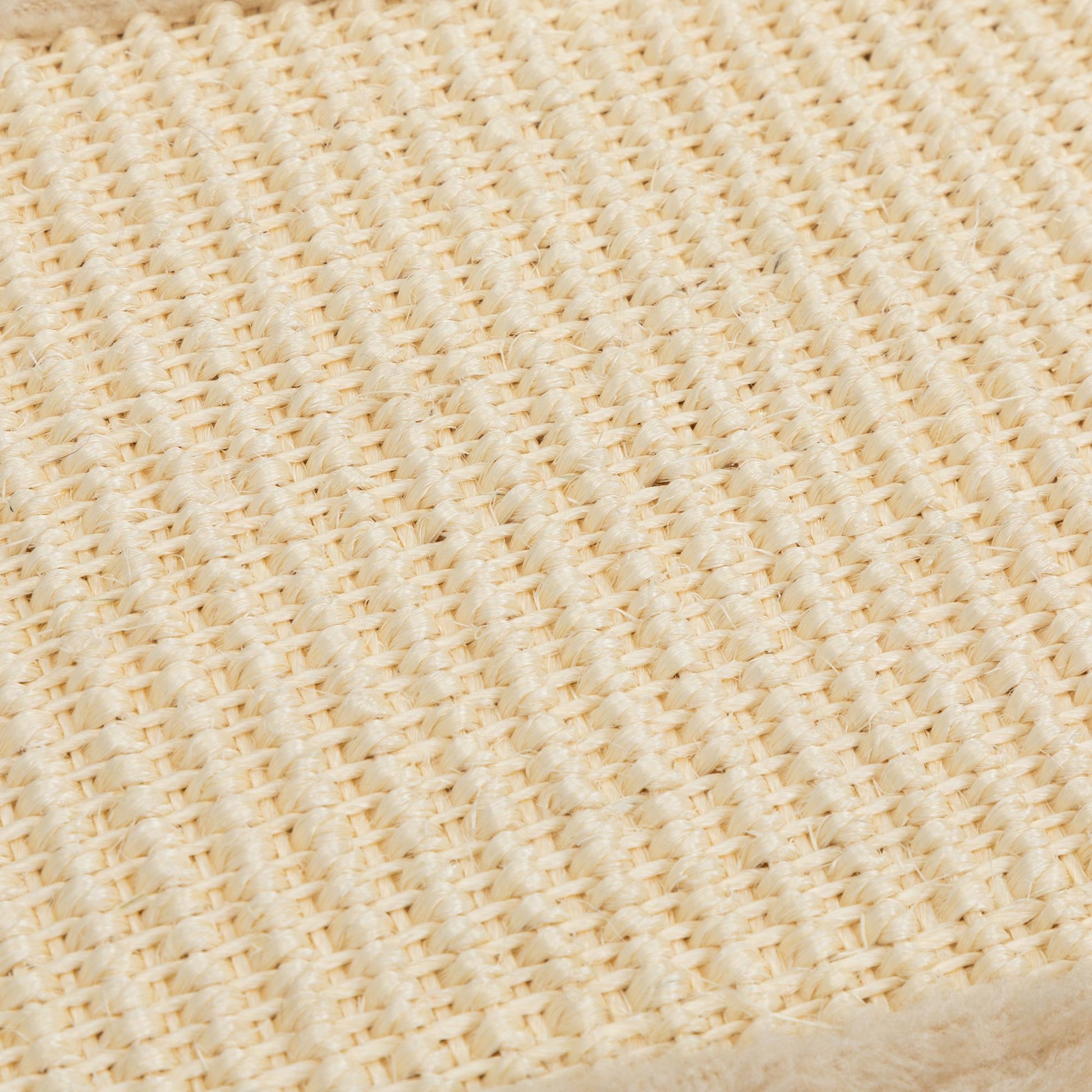 Close-up of The Grove Set’s woven sisal scratch mat. The tightly braided natural fibers offer a durable, satisfying surface for clawing—designed to protect furniture while honoring feline instinct.