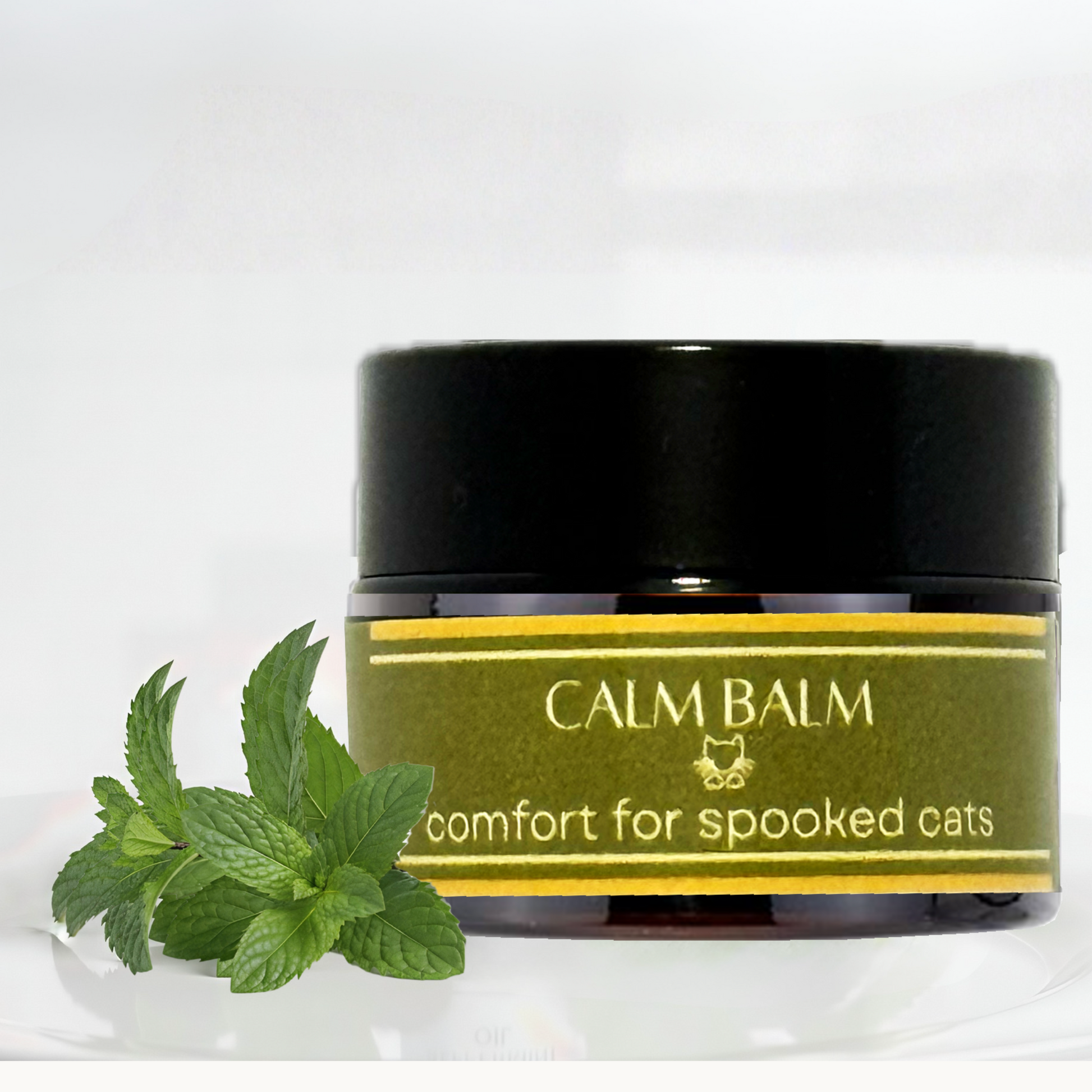 Feline Grove's Calm Balm jar with a label and catnip leaves on a white background