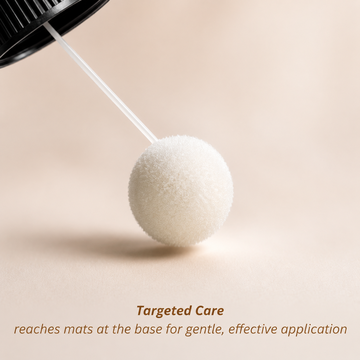 Closeup of cotton ball looking applicator for mat remover for cats with the words "targeted care reaches mats at the base for gentle, effective application"